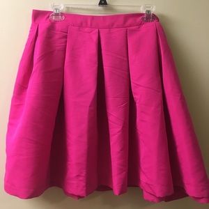 Pink pleated mini skirt.